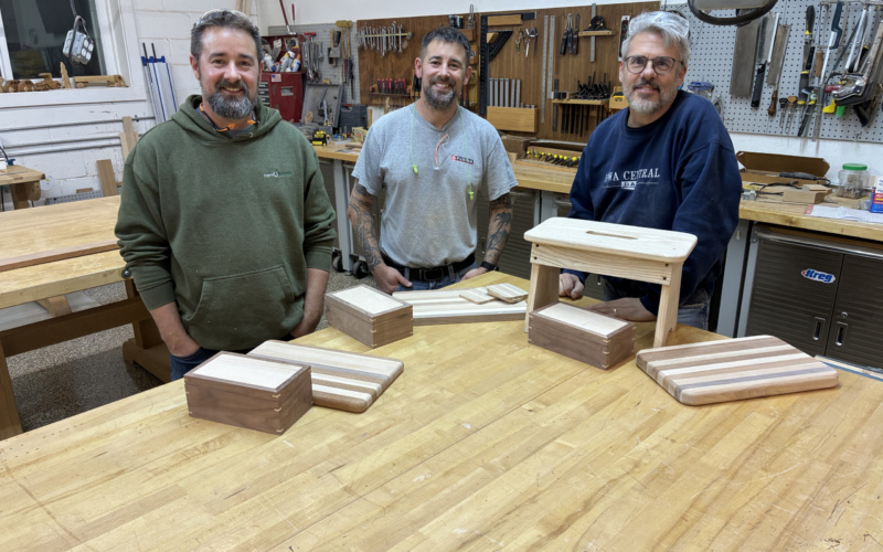 The 2026 adult woodworking class and their projects.